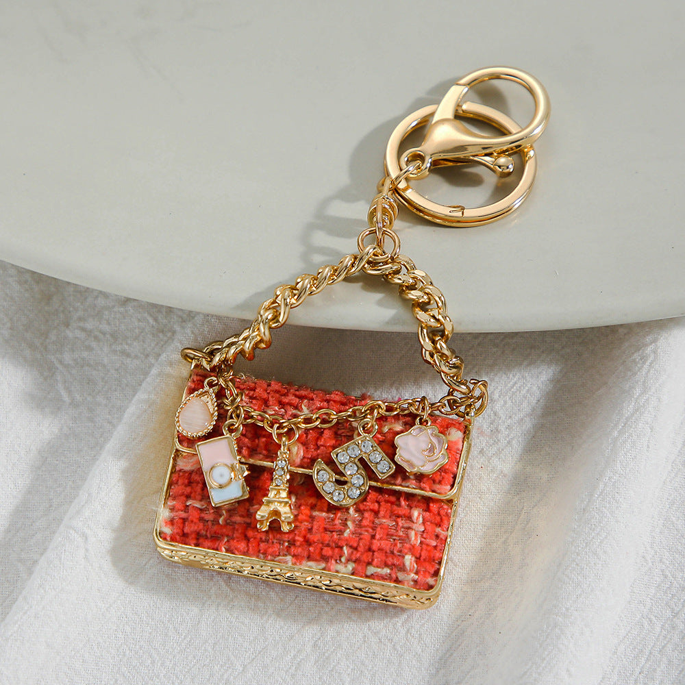 SISSLIA Eye-catching Light Luxury Fashionable Unique Design Creative Woven Plaid Bag Keychain Small Pendant Metal Keychain Pendant
