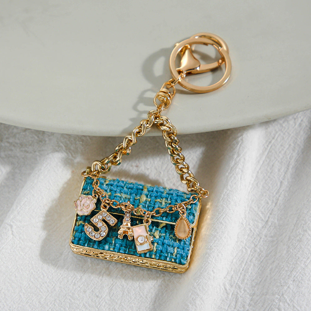 SISSLIA Eye-catching Light Luxury Fashionable Unique Design Creative Woven Plaid Bag Keychain Small Pendant Metal Keychain Pendant
