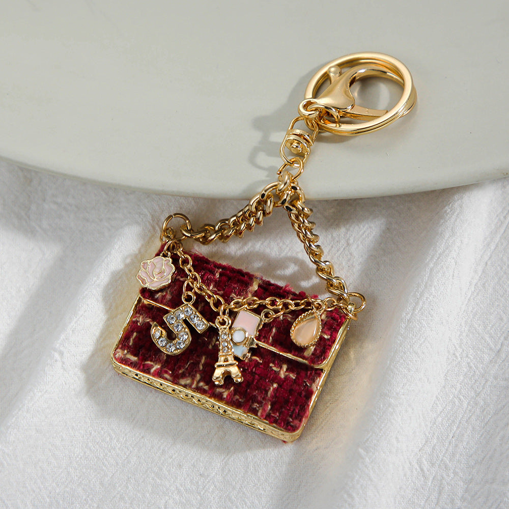 SISSLIA Eye-catching Light Luxury Fashionable Unique Design Creative Woven Plaid Bag Keychain Small Pendant Metal Keychain Pendant